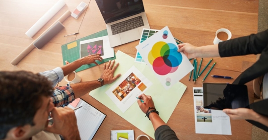 Young entrepreneurs discussing their brand's color palette