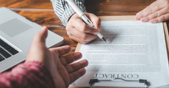 Colleagues Reviewing Contracts